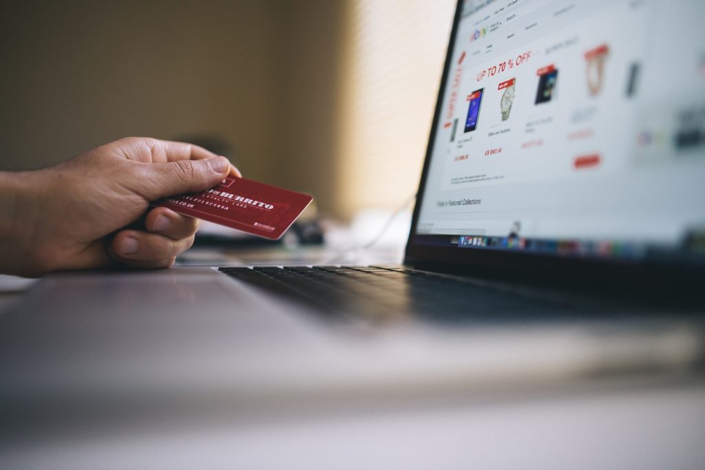 Person making an online purchase with a credit card