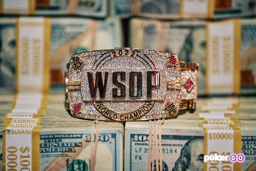 2022 WSOP Main Event bracelet on a stack of cash