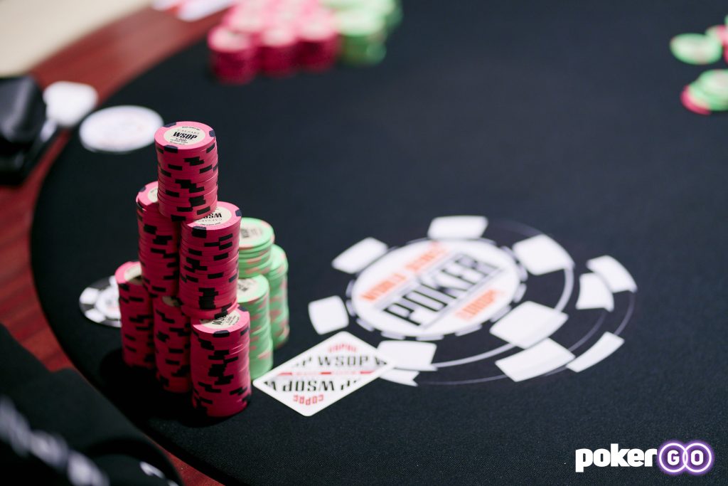 2023 WSOP table with chips and cards